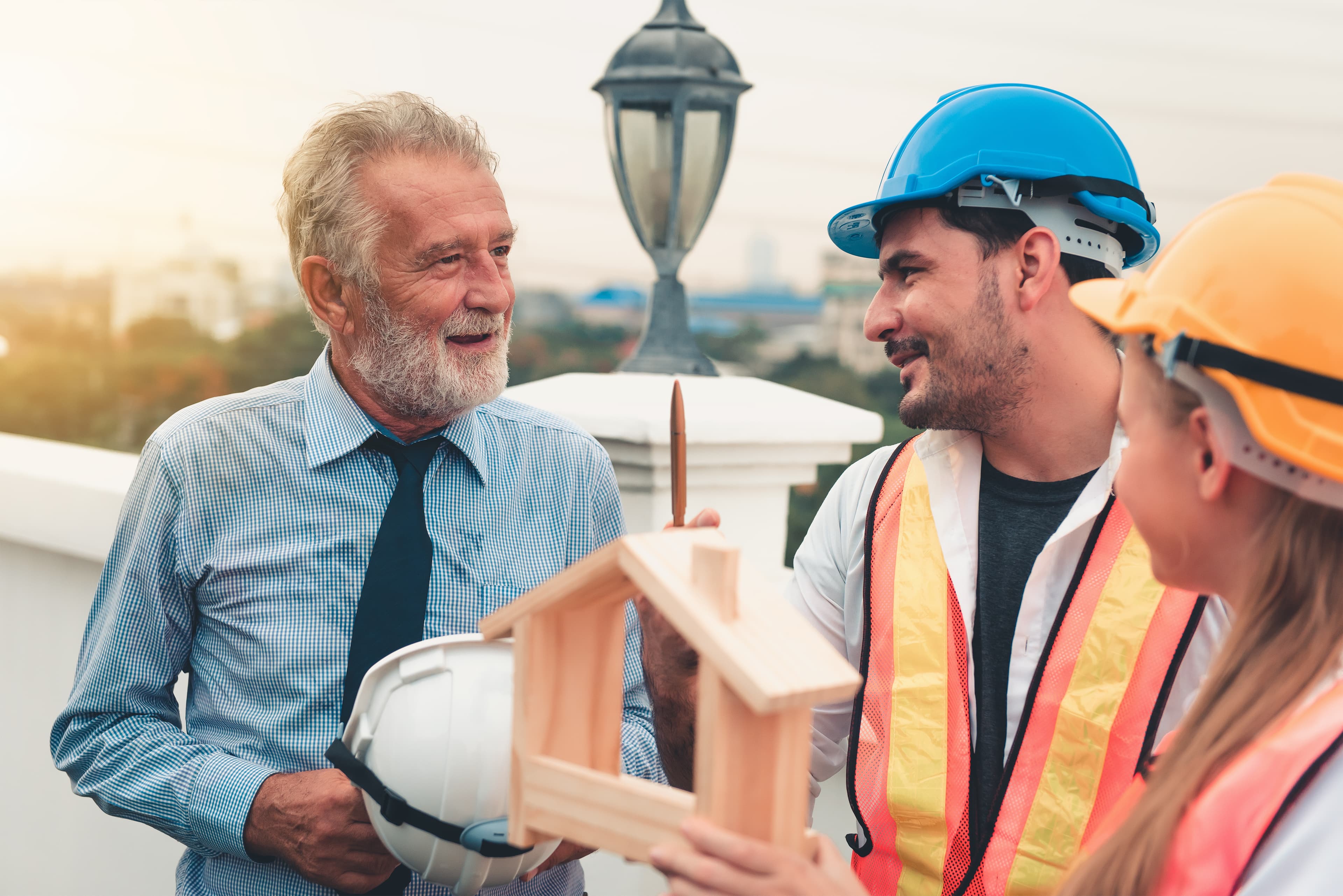 Builders and restorer discuss plans for insurance rebuild.